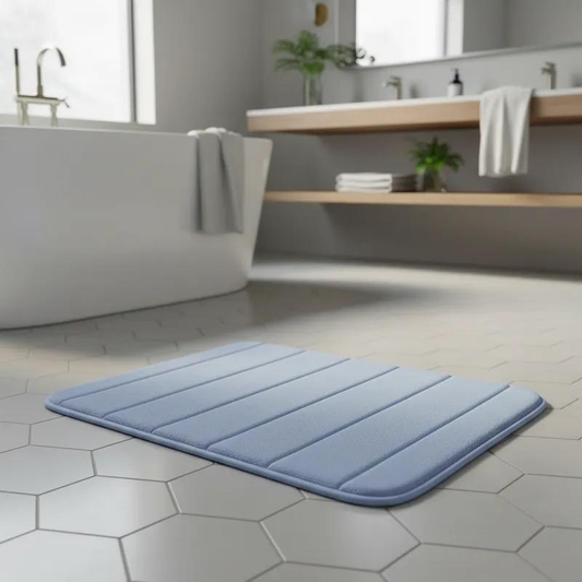 tapete de banheiro soft super absorvente cor azul ao lado da banheira