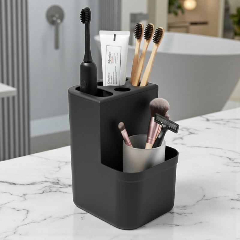 porta escova preto com escova, pasta de dente, acessórios de maquiagem